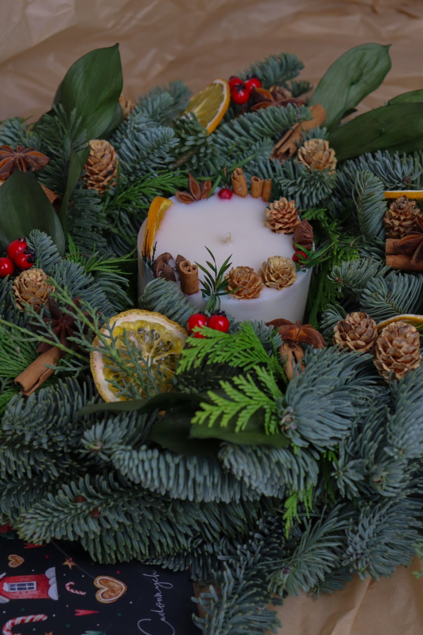 Holiday candle in jar, infused with cinnamon, clove and orange—the perfect Christmas gift