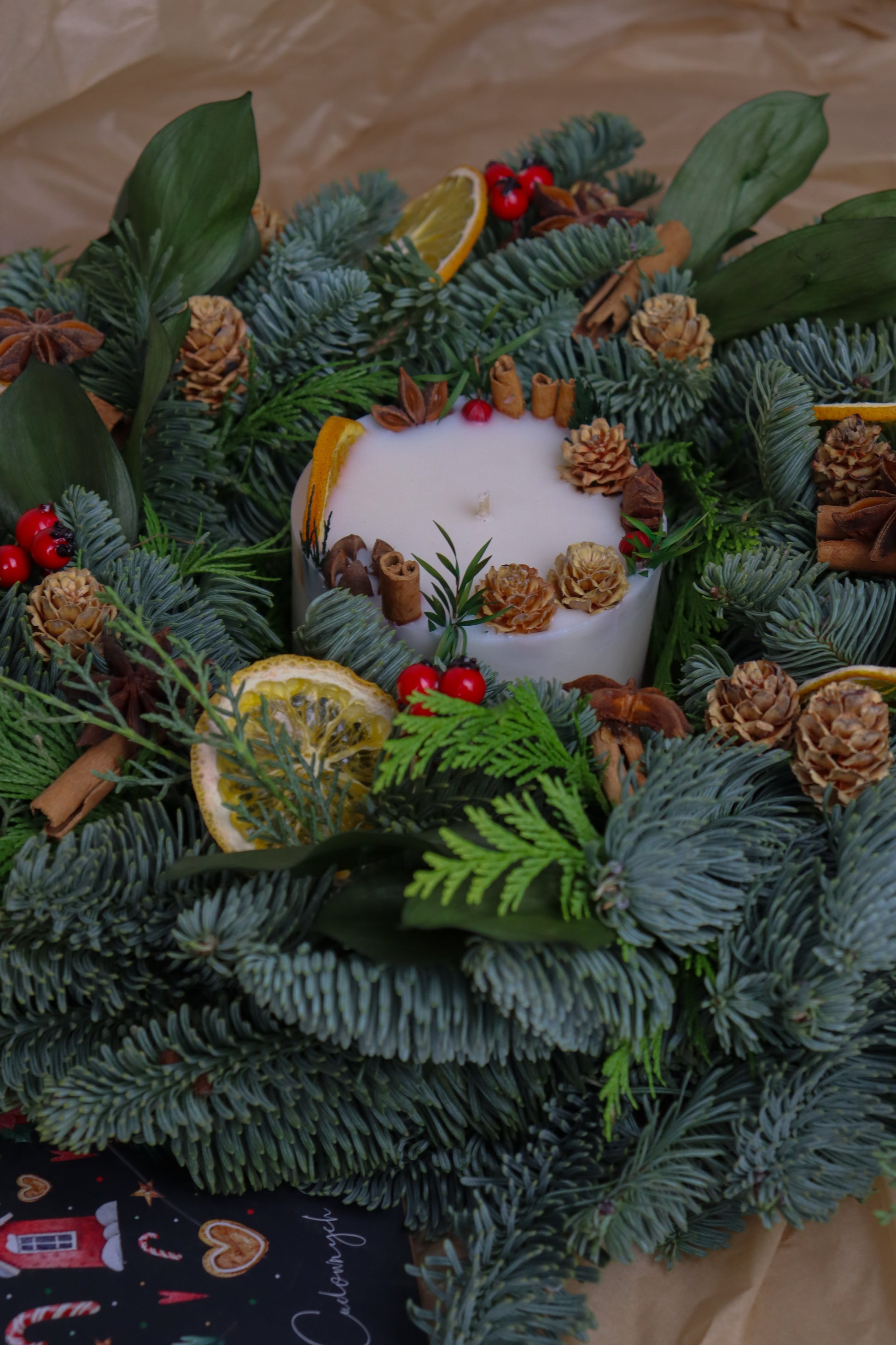 Holiday candle in jar, infused with cinnamon, clove and orange—the perfect Christmas gift