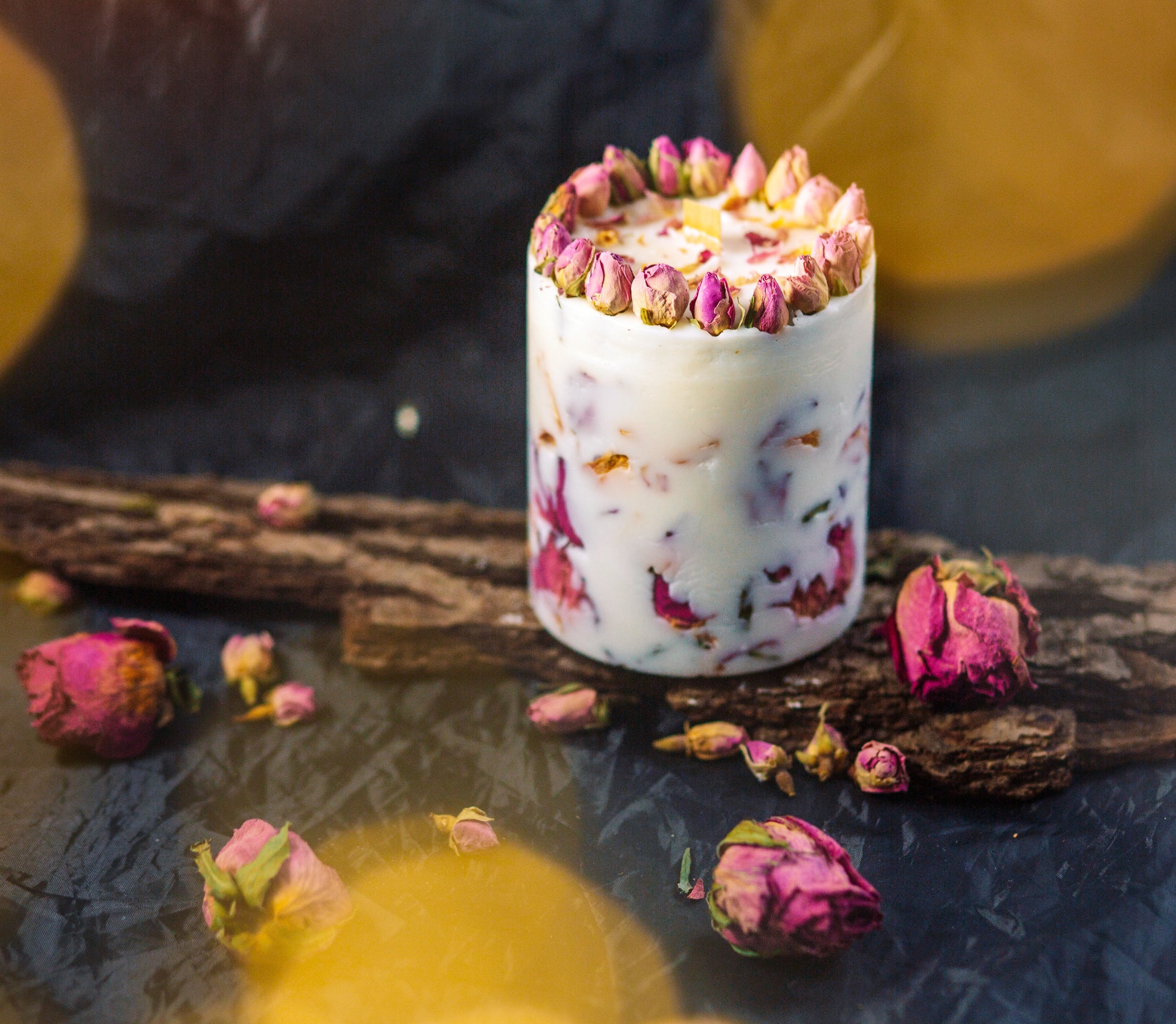 Botanical rose candle beautifully placed on the background.