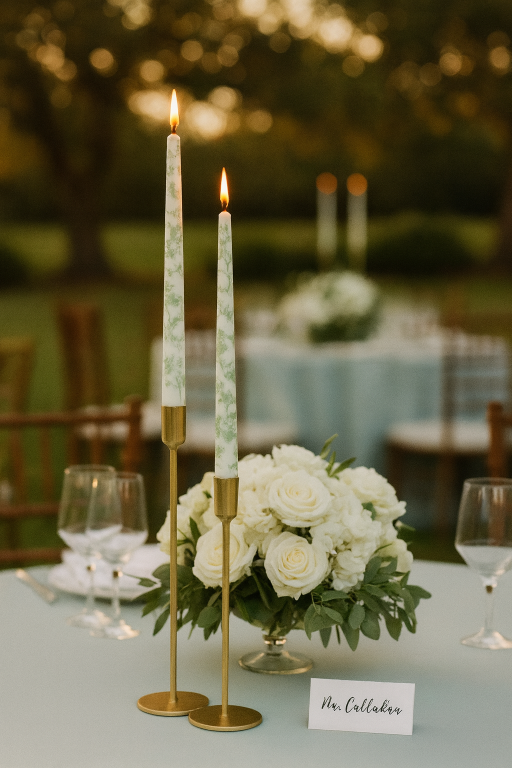 Green-and-white inspired pattern on elongated taper dinner candles