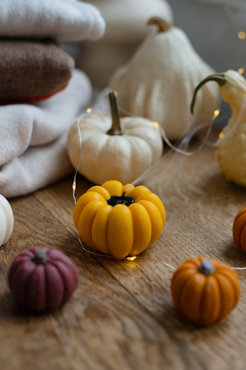 Cute pumpkin decorative candles as a perfect autumn home decor gift. 