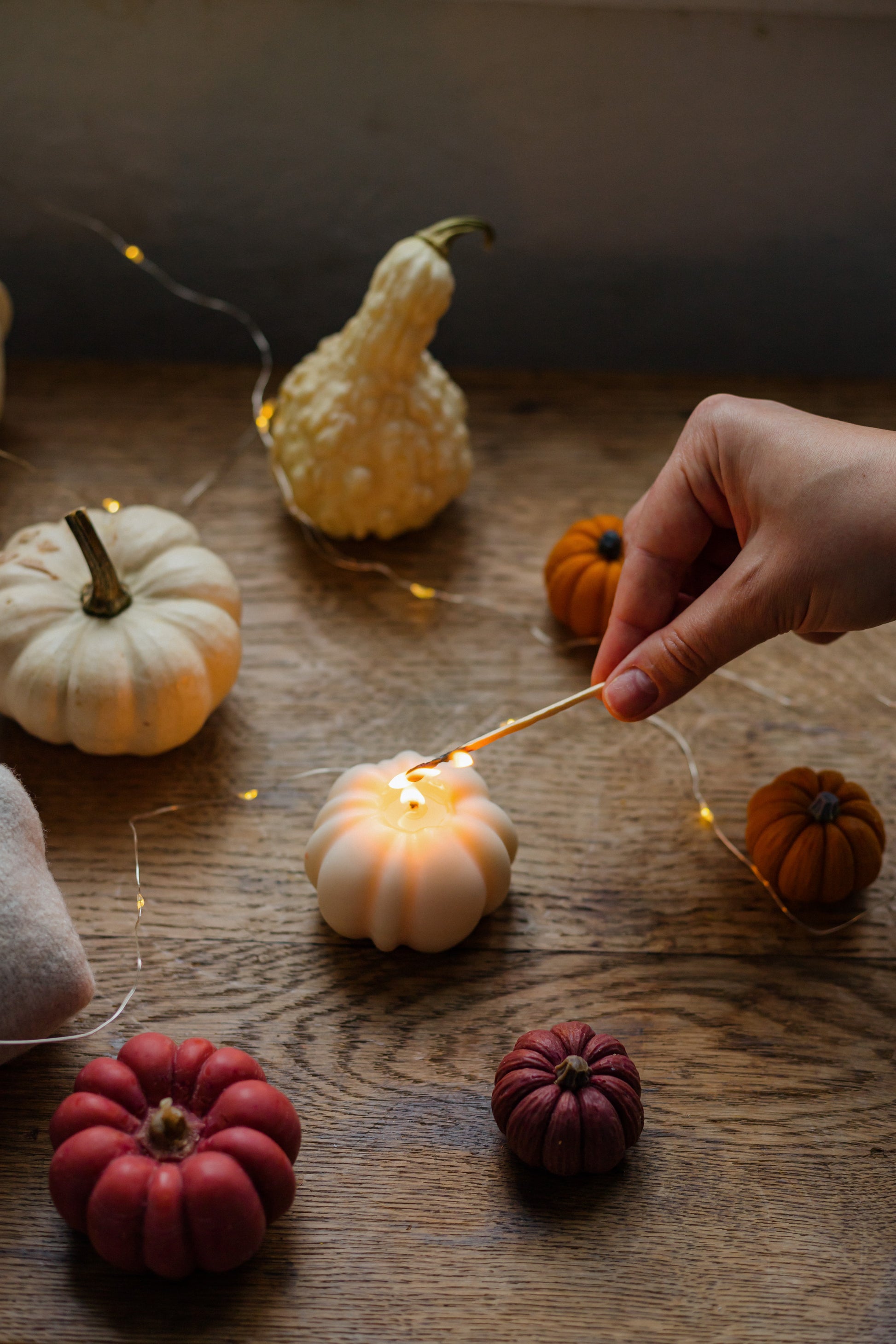 Close-up of realistic pumpkin candle bringing cozy seasonal ambiance